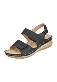 Sandalia negra con dos correas ajustables de Velcro, plantilla acolchada y suela de cuña baja con un detalle brillante.