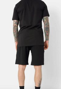 Sixth June ESSENTIEL - Pantalones deportivos - black