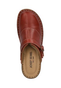 Red leather clog with an open back, stitched accents, and a metal buckle. The interior features a soft tan insole.
