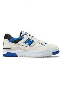 White leather sneakers with black and blue accents, featuring a perforated upper, bold "N" logo, and a thick blue-tinged sole. Model 550.