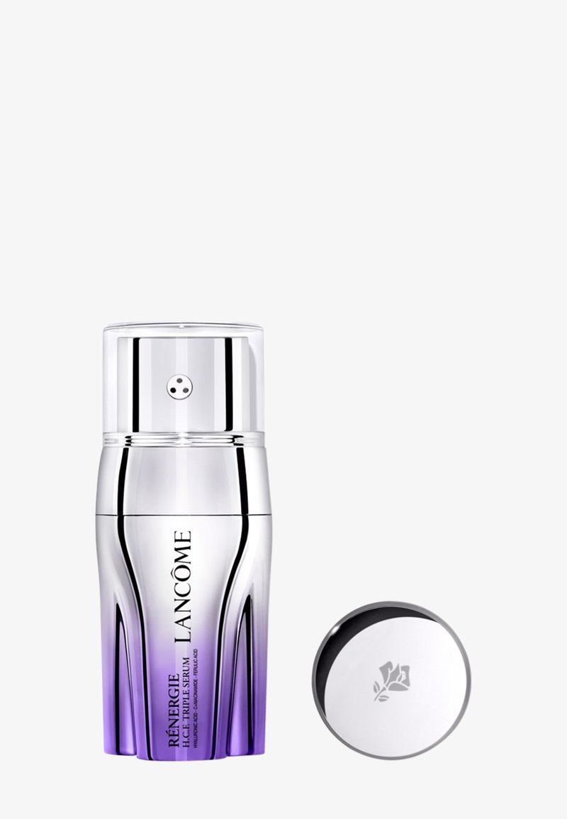 Silberne und lilafarbene Lancôme Rénergie H.C.F. Triple Serum Pumpflasche mit abgenommenem reflektierendem silbernem Deckel, der das Lancôme-Rosenlogo zeigt.