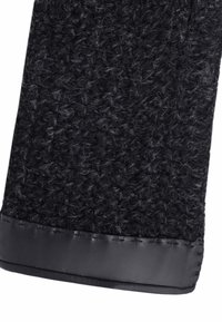 Tissu noir texturé avec une finition duveteuse, présentant une bordure en cuir noir lisse en bas. Le design global est rectangulaire.