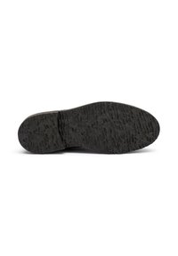 Suola di scarpa in gomma nera con superficie texture, caratterizzata da motivi in rilievo per migliorare la trazione. Forma arrotondata con bordo liscio.