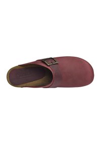 Burgundy leather clog with a wide strap, featuring a bronze buckle accent and a smooth, matte texture. Cushioned footbed visible.