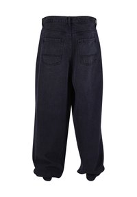 Loose fit black denim jeans with high waist and two back pockets, shown from the rear.