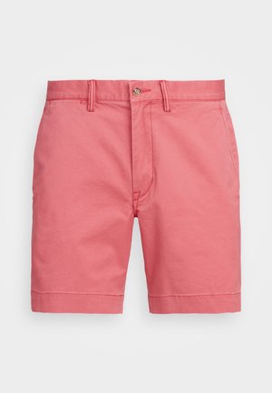 Rosa bomullsshorts med en jevn tekstur, med knappelukking, beltehemper og oppbrettete nederkant. Klassisk snitt og avslappet design.