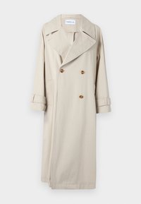 Beige trench coat made of cotton, featuring a double-breasted front, large lapels, and button accents. Includes side pockets and cuffed sleeves.