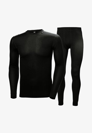 Conjunto de top de manga larga negro y leggings, hecho de una tela elástica, que presenta una textura suave y un diseño ajustado para mejorar la movilidad.