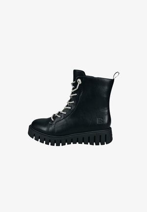 Schwarze Lederstiefeletten mit silbernen Schnürsenkeln, einer runden Zehenform und einer dicken, gerippten Gummisohle. Sie verfügen über eine Zuglasche an der Rückseite für ein einfaches Anziehen.