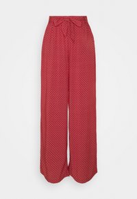 Rote weit geschnittene Hose mit einem Bindeband, die ein geometrisches weißes Muster aufweist. Hergestellt aus leichtem Stoff, mit einer glatten Textur und lockerer Passform.