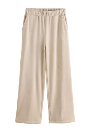 Pantalon large en velours côtelé beige avec taille élastique et poches latérales, présenté à plat sur fond blanc.