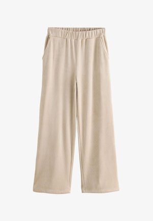 Pantalon large en velours côtelé beige avec taille élastique et poches latérales, présenté à plat sur fond blanc.
