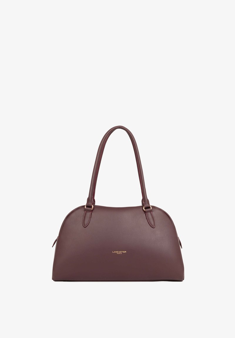 Sac à main en cuir marron foncé avec deux anses et petit logo doré Lancaster Paris au centre devant.