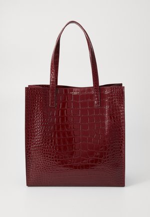 Red faux leather tote bag with a glossy crocodile pattern, rectangular shape, and dual handles, featuring a minimalist design and no visible hardware.