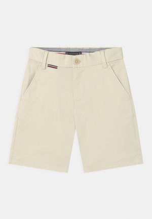 Beige shorts lavet af bomuld med knaplukning, sidelommer og en stribet inderlinning. Glat tekstur og skræddersyet design.