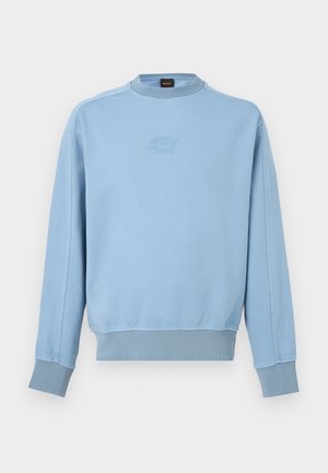 Svijetloplava majica dugih rukava s rebrastim manšetama i rubom, okruglim izrezom i suptilnim toniranim logotipom na prsima.