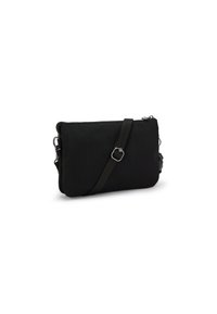 Sort nylon crossbody taske med lynlås, justerbar rem og sølvfarvede metaldele. Glat tekstur og rektangulær form.