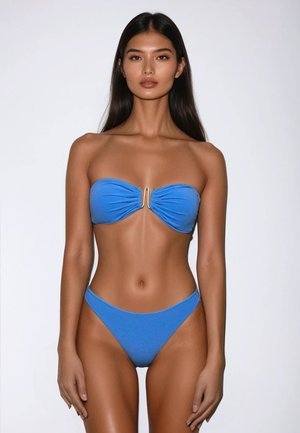 Blue bandeau bikini with gathered fabric and gold hardware detail at the center, paired with high-waisted bottoms. Smooth texture.