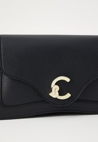 Black leather clutch with a textured finish, featuring a gold-tone clasp with intertwined letters, and curved stitching details.