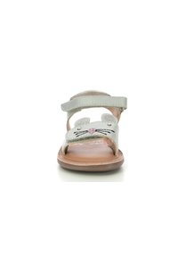 Silver children's sandals with a rabbit face design, featuring sparkly accents and Velcro straps. Textured brown sole. Open toe design.