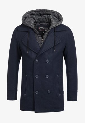 Abrigo azul marino de doble botonadura con un forro gris con capucha, que presenta un tejido texturizado, grandes botones y bolsillos laterales.