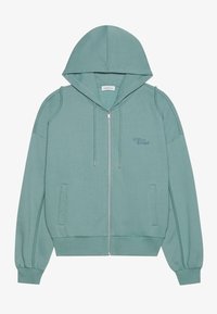 Hooded zip-up dukserica od mekog, svijetlozelenog materijala. Sadrži rebraste manžete, dva bočna đepa i diskretno izvezeno logo na prsima.