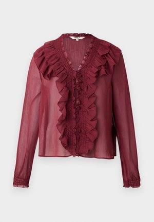 Burgundy sheer blouse with long sleeves, ruffled collar, and front line detailing. Soft material with a lightweight, flowing texture.