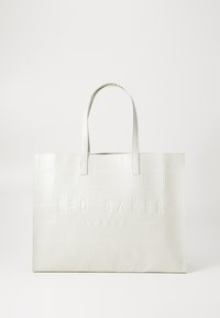 White crocodile-embossed tote bag with two long handles and embossed "TED BAKER LONDON" text on the front. Smooth, glossy finish.