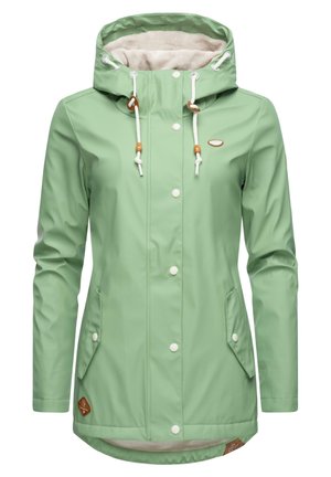 Light green waterproof jacket with a cozy beige fleece-lined hood, white drawstrings, snap buttons, and side pockets. Brown branding detail included.