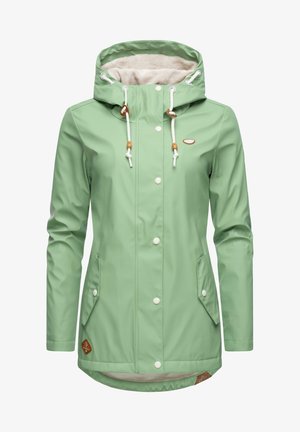 Light green waterproof jacket with a cozy beige fleece-lined hood, white drawstrings, snap buttons, and side pockets. Brown branding detail included.