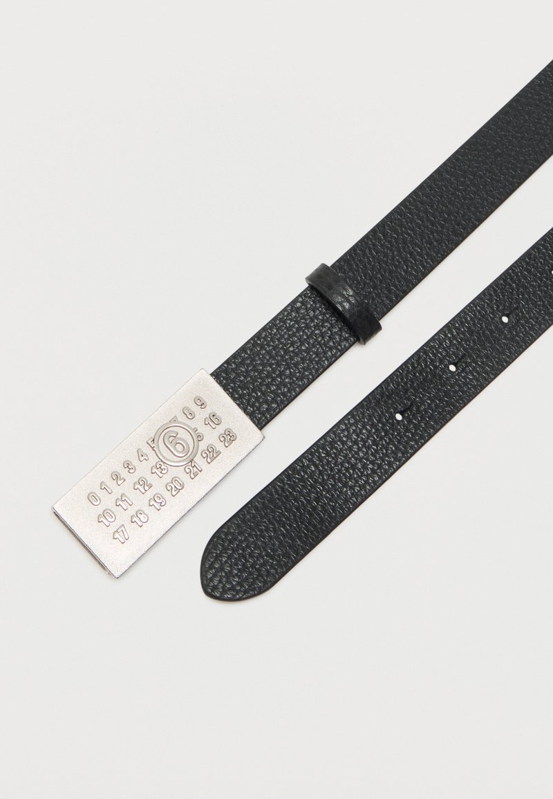 Black textured leather belt with a silver rectangular buckle featuring engraved numbers and a circled 6 in the center.