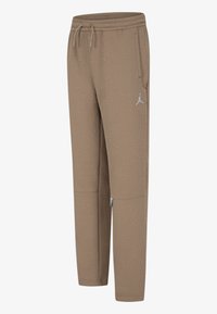 Bruna träningsbyxor med ett geometriskt texturmönster, elastisk midja med dragsko och sidofickor. Vitsigt logotypdetalj.