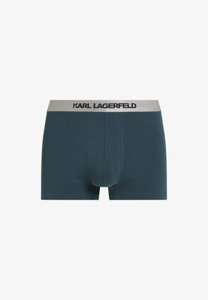 Pánske boxerky v tmavo tyrkysovej látke so soft elastickým šedým pásom s potlačou "KARL LAGERFELD" v čiernej farbe. Klasický strih s minimálnym počtom švov.