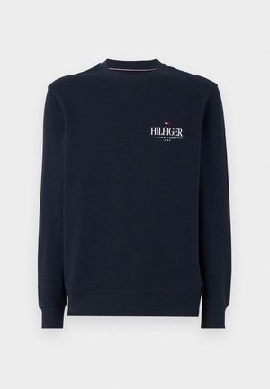 Tengerészkék pamut pulóver, kerek nyakú, bordás mandzsettákkal és derékrésszel, fehér "HILFIGER" logóval a mellkason.