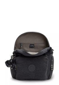 Black fabric backpack with a rounded top, multiple zippered pockets, and a small furry keychain. Interior features a lined compartment.