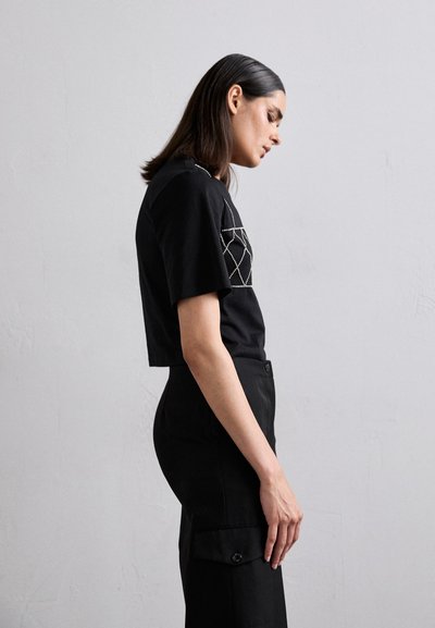 sandro JOSEPHY - Cargo trousers - noir