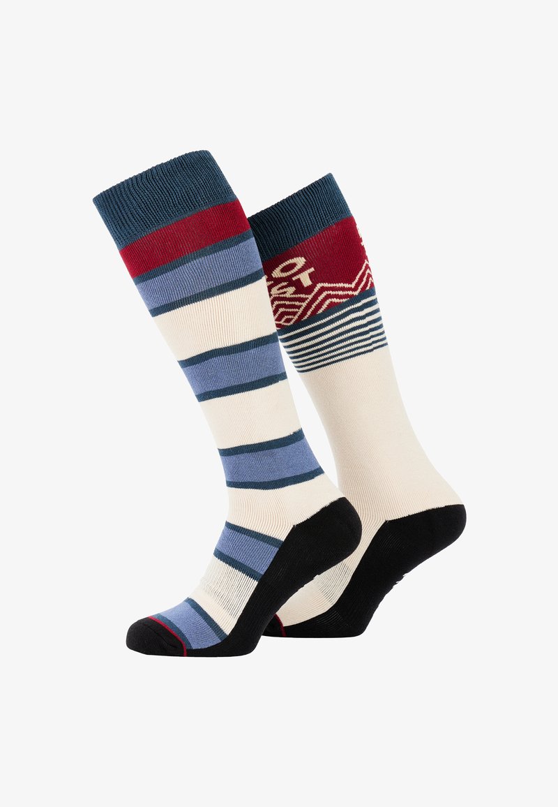 Stribede knæhøje sokker med et blåt og kremfarvet mønster med røde accenter og et geometrisk design på kanten. Sorte såler.