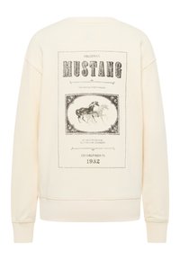 Kremowy sweatshirt z czarnym, vintage'owym nadrukiem graficznym przedstawiającym konie oraz tekst. Ściągacze na rękawach i dolnej krawędzi, wykonany z miękkiego materiału bawełnianego.