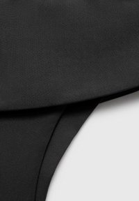 Black bikini bottom made of smooth, stretchy fabric. Features a folded waistband and minimal coverage design, showcasing a sleek, solid color.