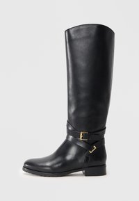 Black leather knee-high boot with a rounded toe, a textured finish, decorative strap with a gold buckle, and a low block heel.