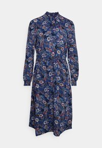 Robe florale avec un fond bleu marine, manches longues, encolure froncée et ceinture à la taille. Le tissu présente un mélange de motifs roses, blancs et verts.