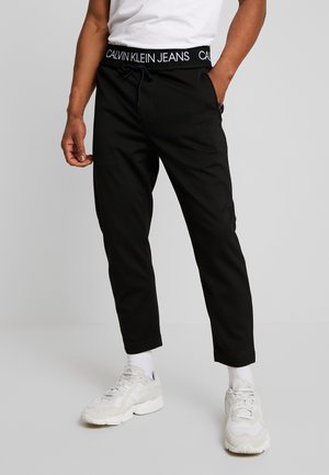 Pantalones deportivos - black