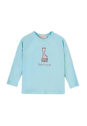 Hellblaues Langarmshirt aus weichem Stoff mit einem braunen gestickten Giraffendesign und Text darunter. Rundhalsauschnitt und Raglanärmel.