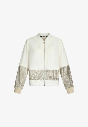 Giacca bomber bianca con pannelli di paillettes argentate su maniche e fondo, colletto arrotondato e chiusura frontale con zip. Tessuto morbido.