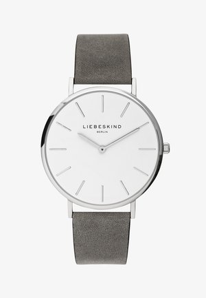 Rund sølvur med en hvid urskive, minimalistiske markører og et gråt læderarmbånd. Har en glat tekstur og subtil branding.