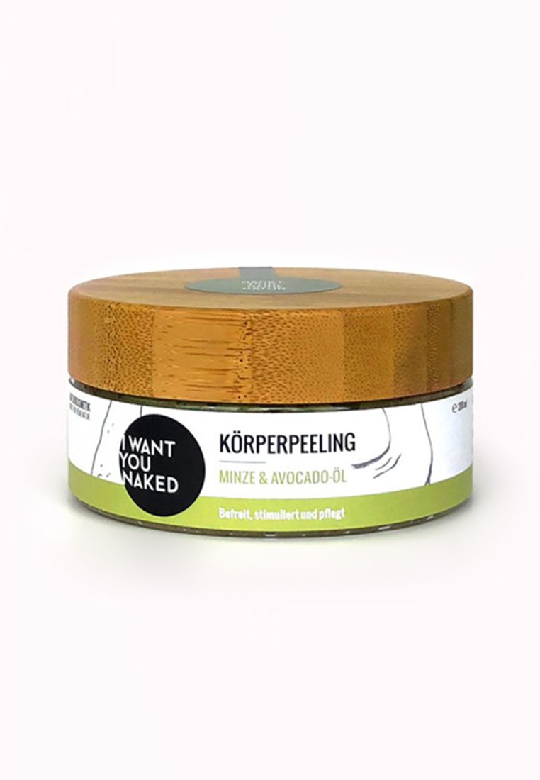 Lichaamspeeling in een ronde container met een bamboeklep. Het etiket heeft groene en witte kleuren met een zwart cirkel logo. Geuren: munt en avocado-olie.