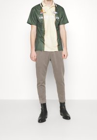 DRYKORN Kalhoty - beige