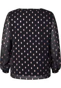 Blusa nera con maniche lunghe e trasparenti, caratterizzata da un motivo a pois in oro rosa metallico. Vestibilità ampia con scollatura rotonda e polsini elasticizzati.