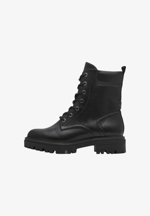 Bottines en cuir noir à lacets, à bout arrondi, avec semelle épaisse et talon renforcé. Présente des accents de couture et une languette de tirage.
