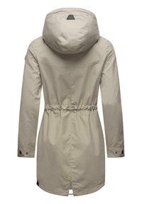 Light beige waterproof jacket with a cinched waist, hood, and buttoned cuffs. Smooth fabric and a vented back hem detail.